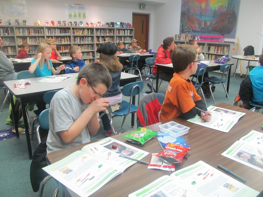 Students learning about ice fishing